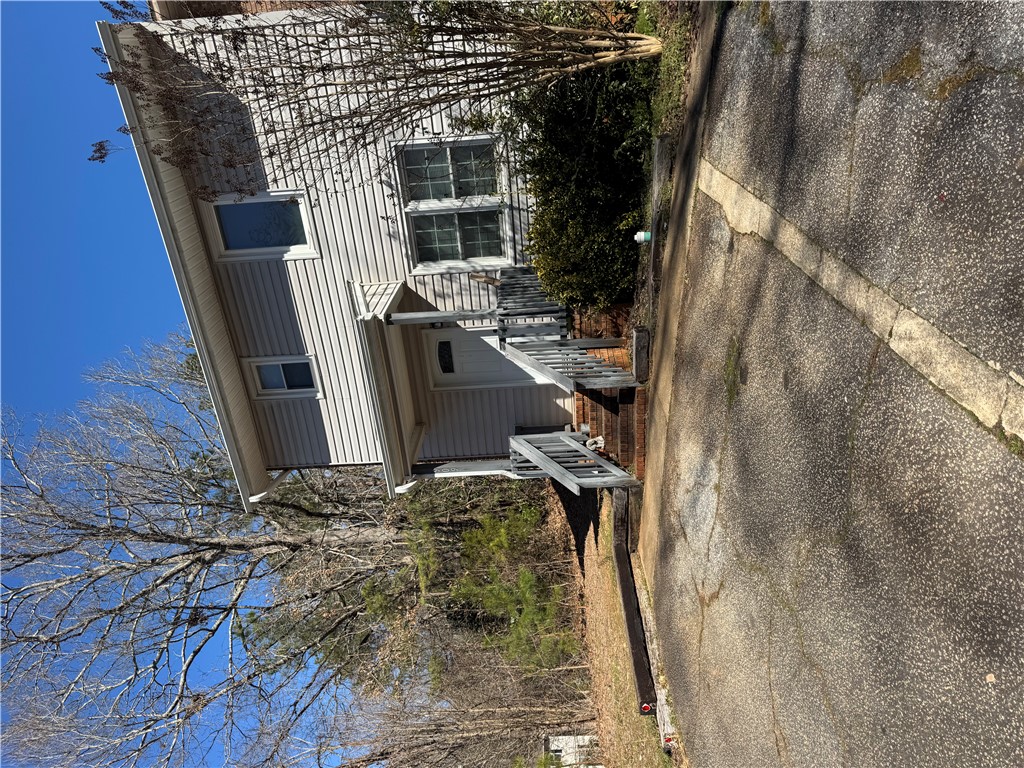 This charming residence offers a welcoming facade with classic architectural details.