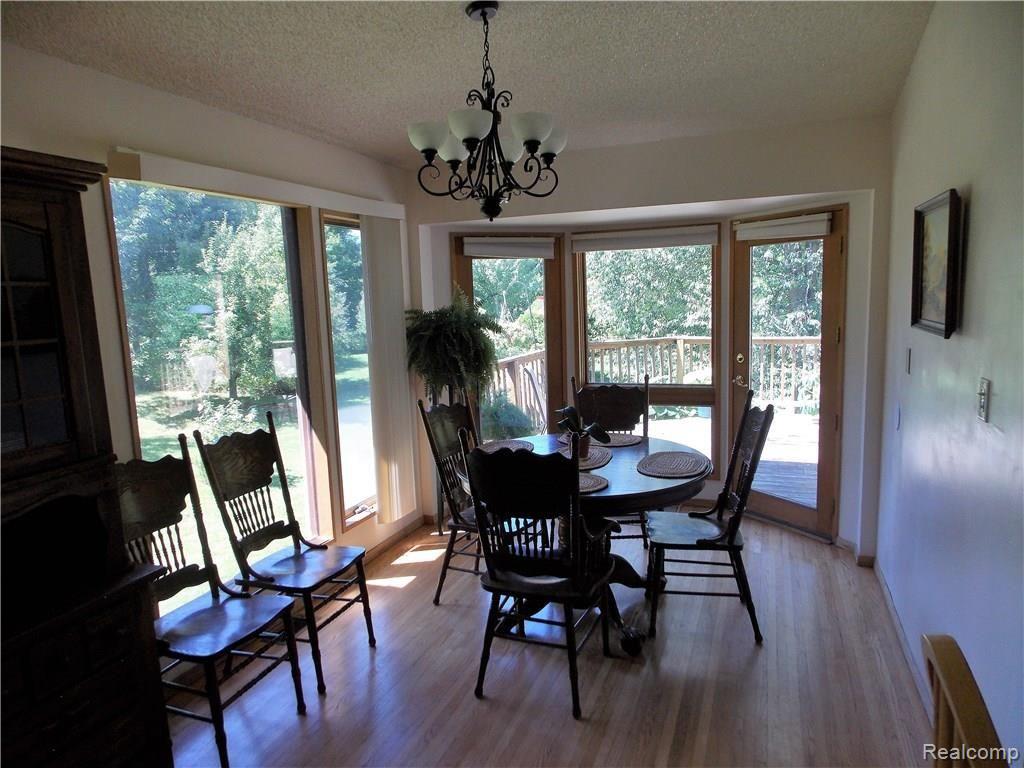 10221 Washburn Road Columbiaville, MI 48421 - Photo 10 of 37 The Dining Room features Oak flooring and is adjacent to the Kitchen. If you continue with the bird feeders, this will be your feathered oasis for many hours a day. You are certain to have first time experiences with the variety and number of birds.