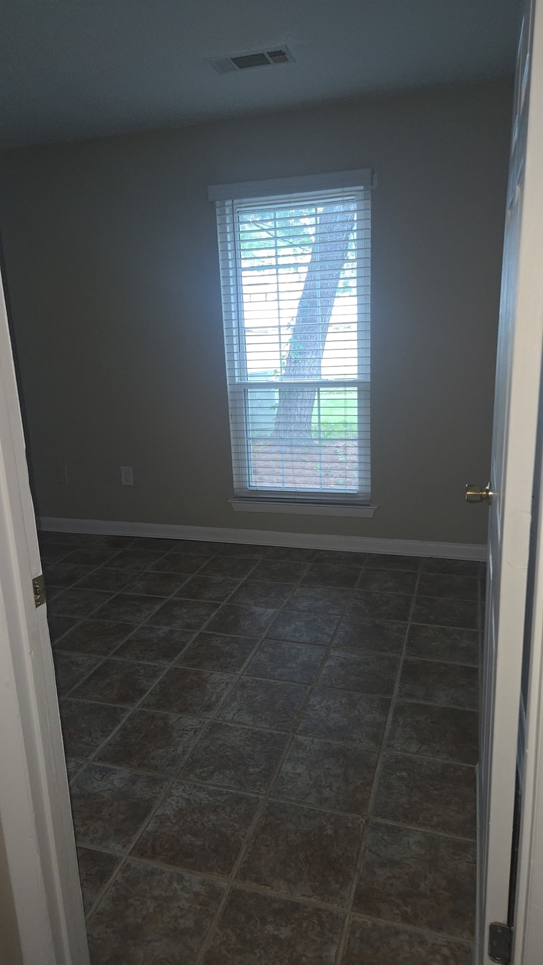 1245 Old Lascassas Road, Unit C Murfreesboro, TN 37130 - Photo 11 of 15 an empty room with wooden floor and windows