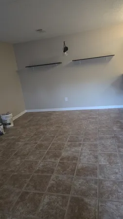 a view of a refrigerator in bathroom