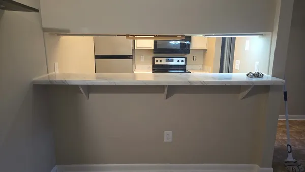 a kitchen with a sink and a window