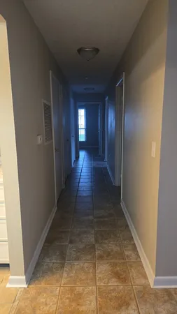 an empty room with a empty space and window