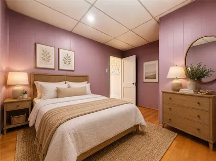 a bedroom with a large bed and a dresser