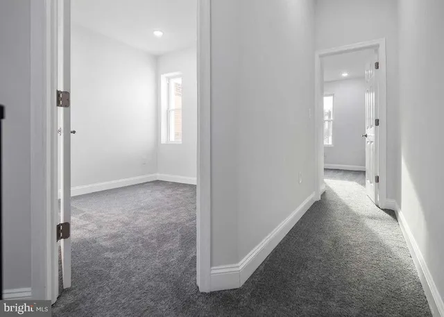 a view of a hallway with a livingroom