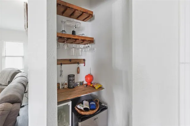 a room with a wooden floor and shoes