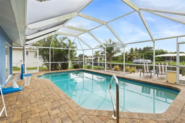 a view of a swimming pool with a porch