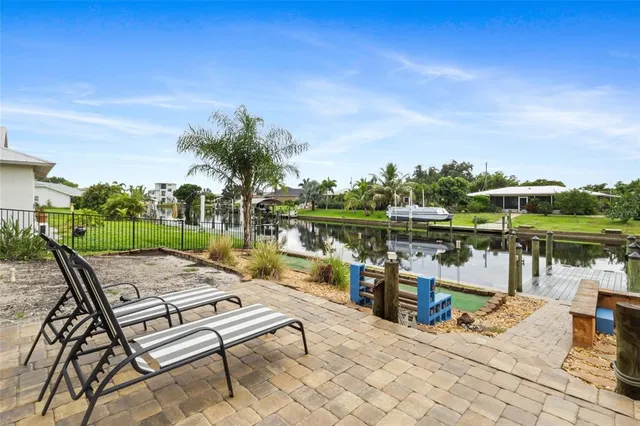 a view of a terrace with chairs and a table