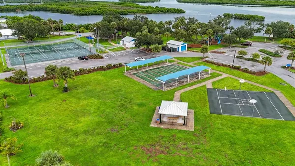 an aerial view of a house with garden space and street view