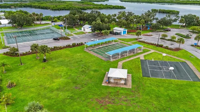 an aerial view of a house with garden space and street view