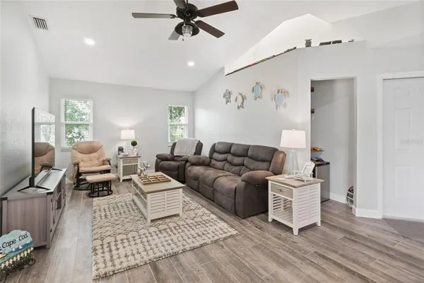 a living room with furniture and a window
