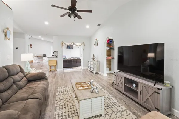 a living room with furniture and a flat screen tv