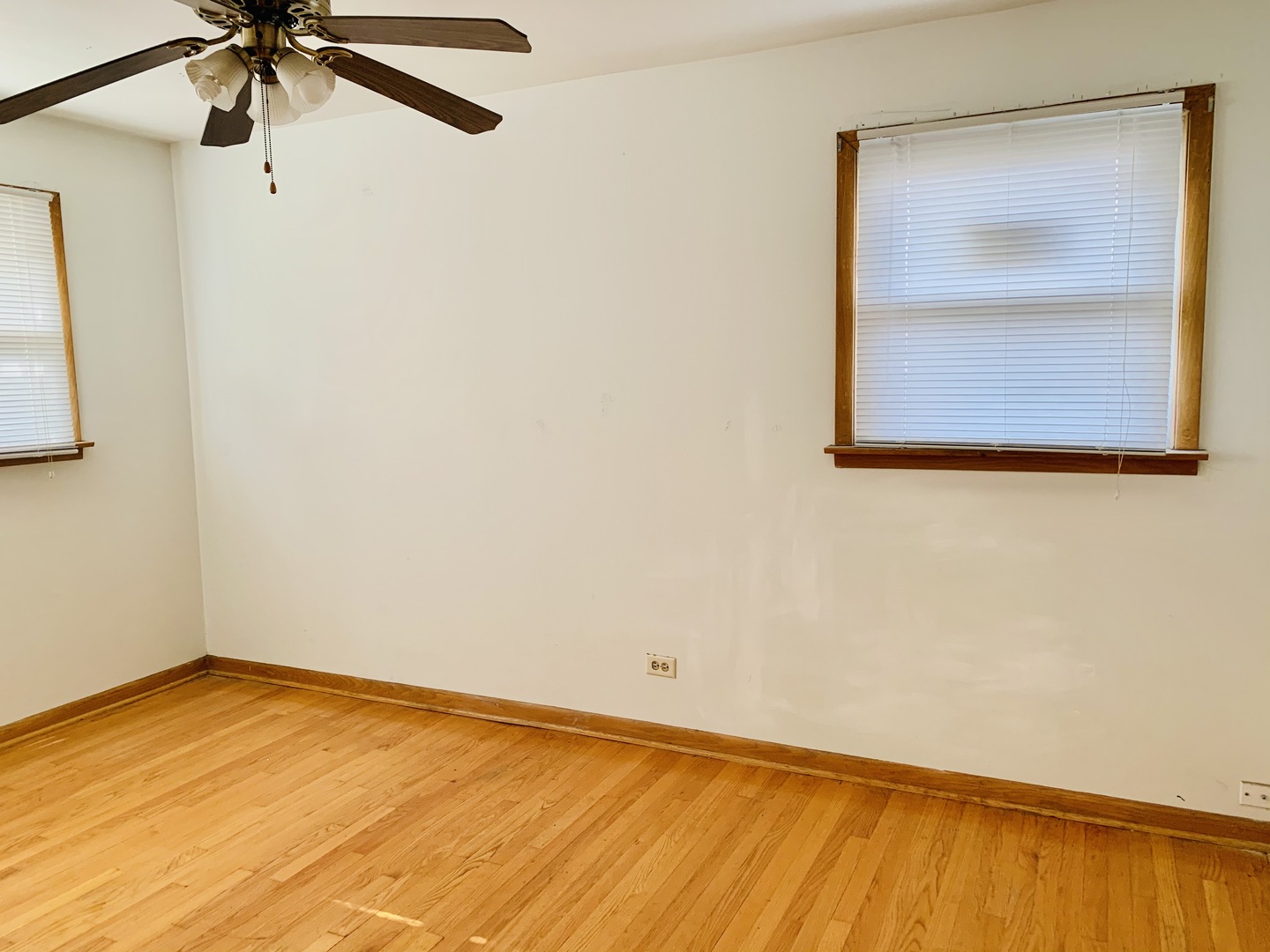 3620 148th Street Midlothian, IL 60445 - Photo 12 of 20 a view of a room with wooden floor and fan