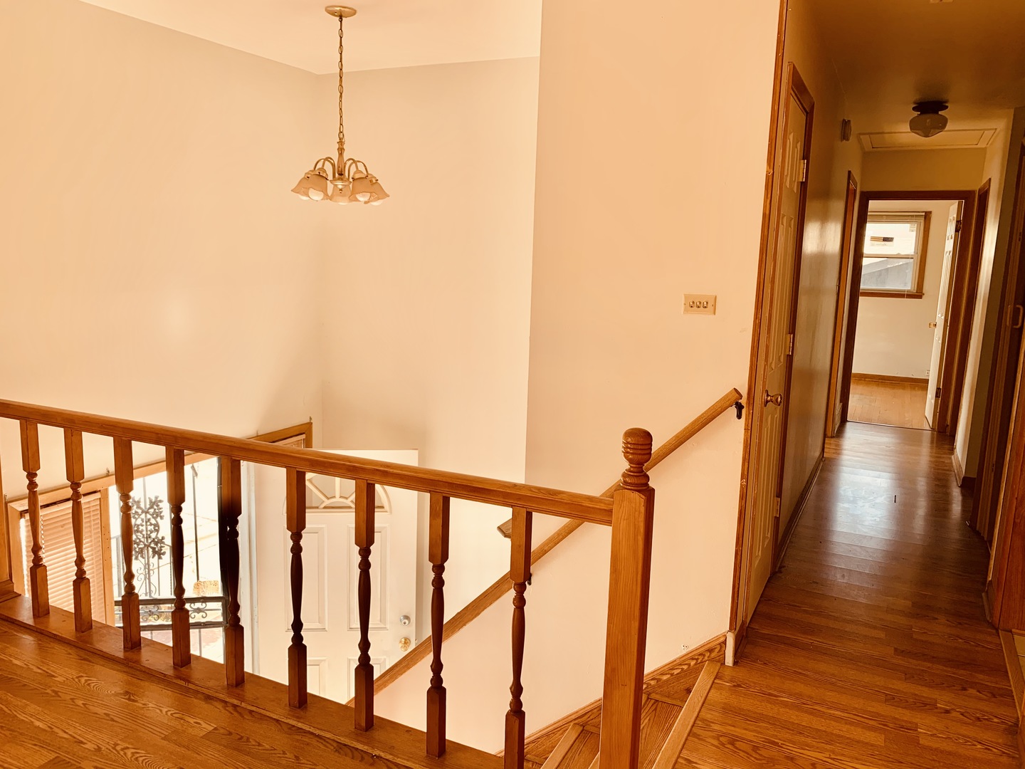 3620 148th Street Midlothian, IL 60445 - Photo 3 of 20 a view of a hallway with wooden floor and stairs