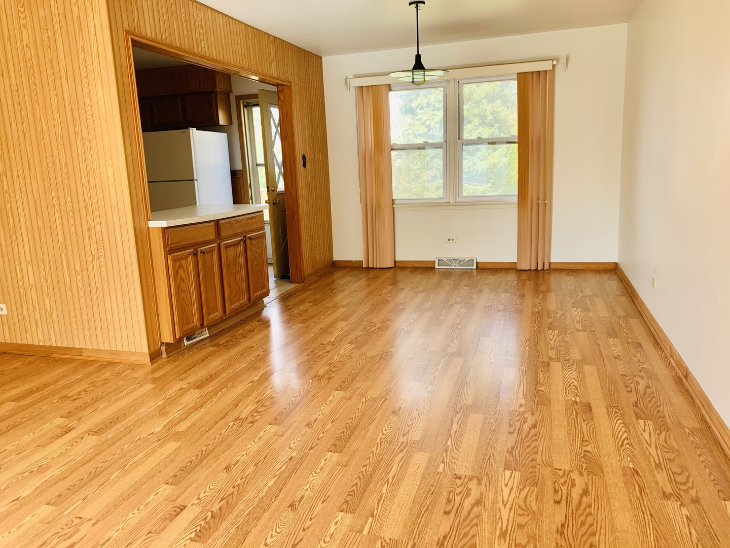 3620 148th Street Midlothian, IL 60445 - Photo 5 of 20 a view of an empty room with wooden floor and a window