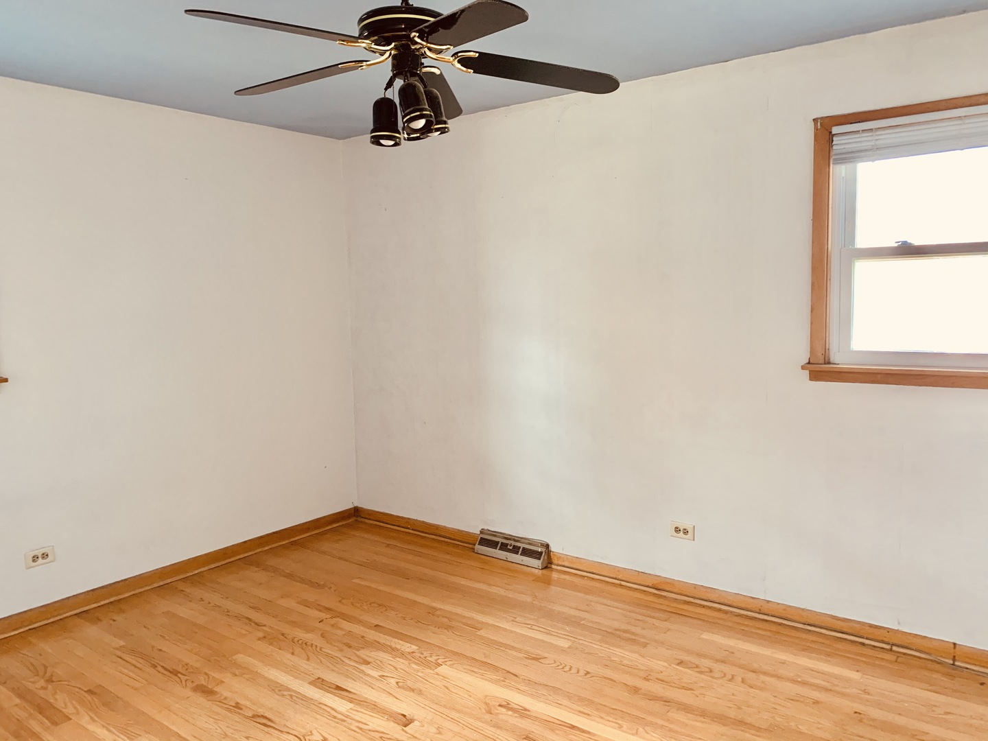 3620 148th Street Midlothian, IL 60445 - Photo 9 of 20 an empty room with a window and a fan