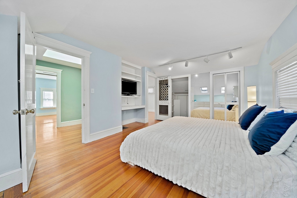 11 Gordon Road Needham, MA 02492 - Photo 23 of 42 a bedroom with a bed and a view of kitchen