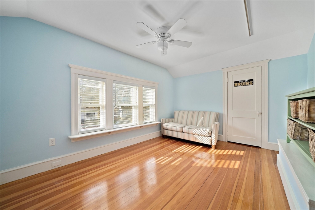 11 Gordon Road Needham, MA 02492 - Photo 27 of 42 an empty room with wooden floor fan and windows
