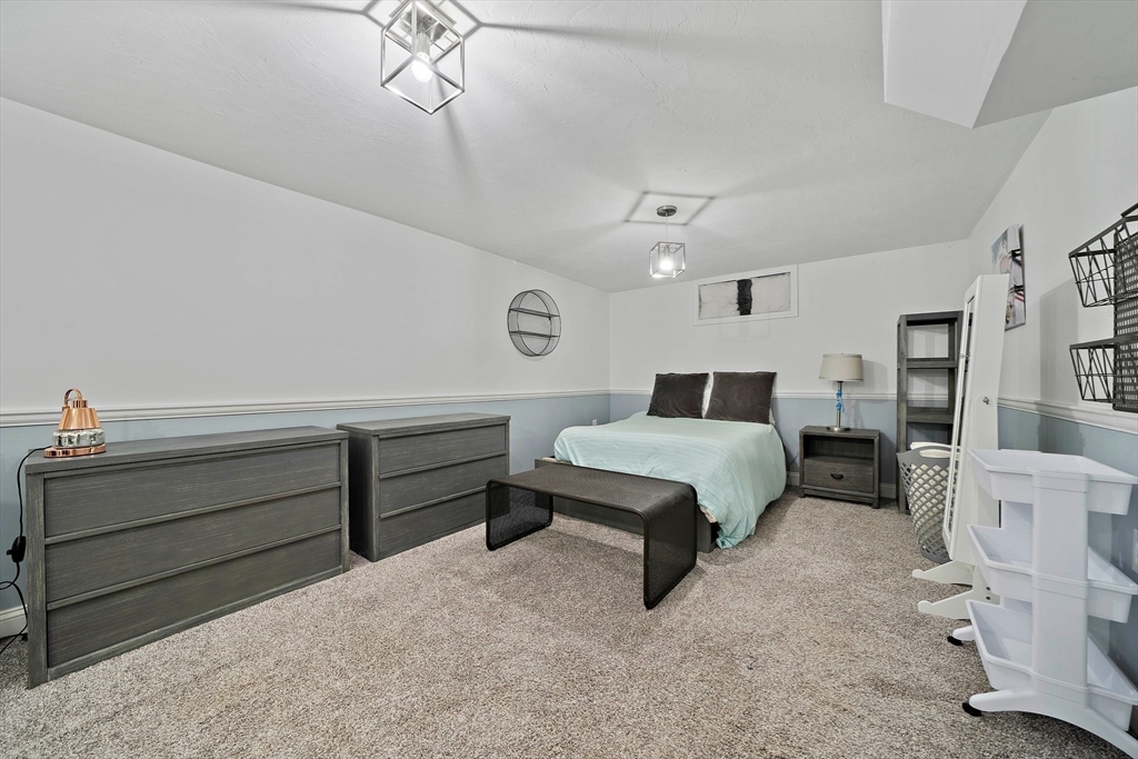 11 Gordon Road Needham, MA 02492 - Photo 32 of 42 a bedroom with furniture and window