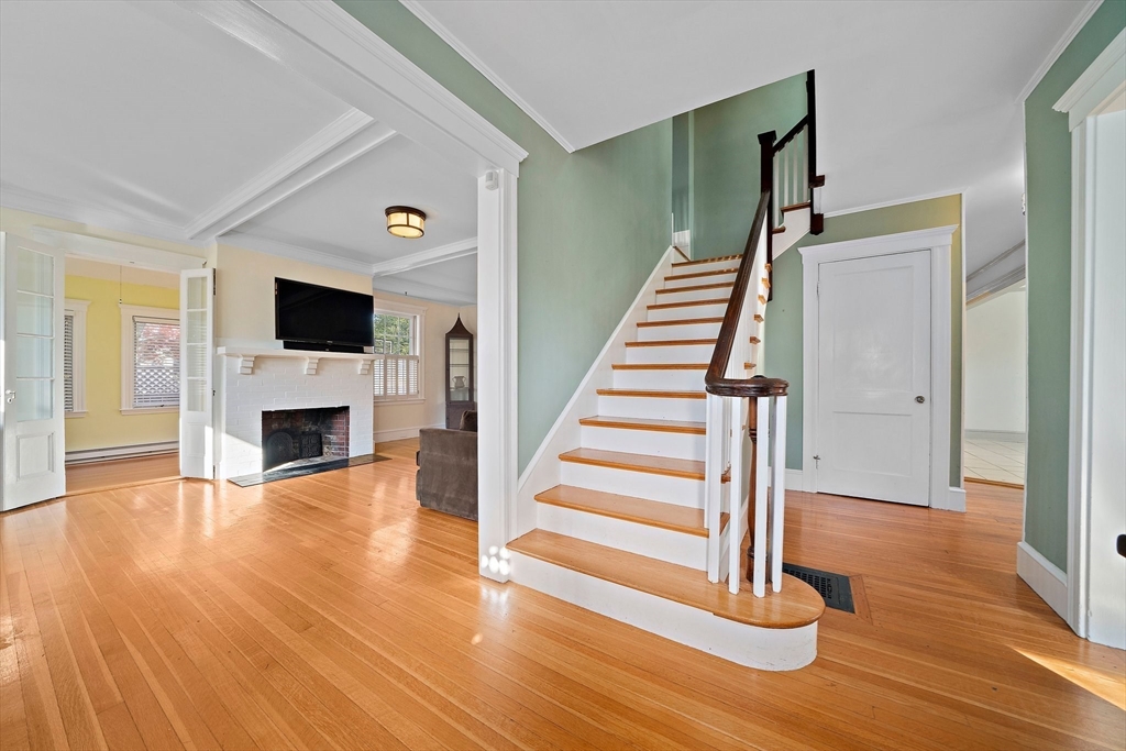 11 Gordon Road Needham, MA 02492 - Photo 6 of 42 a view of a livingroom with wooden floor and staircase