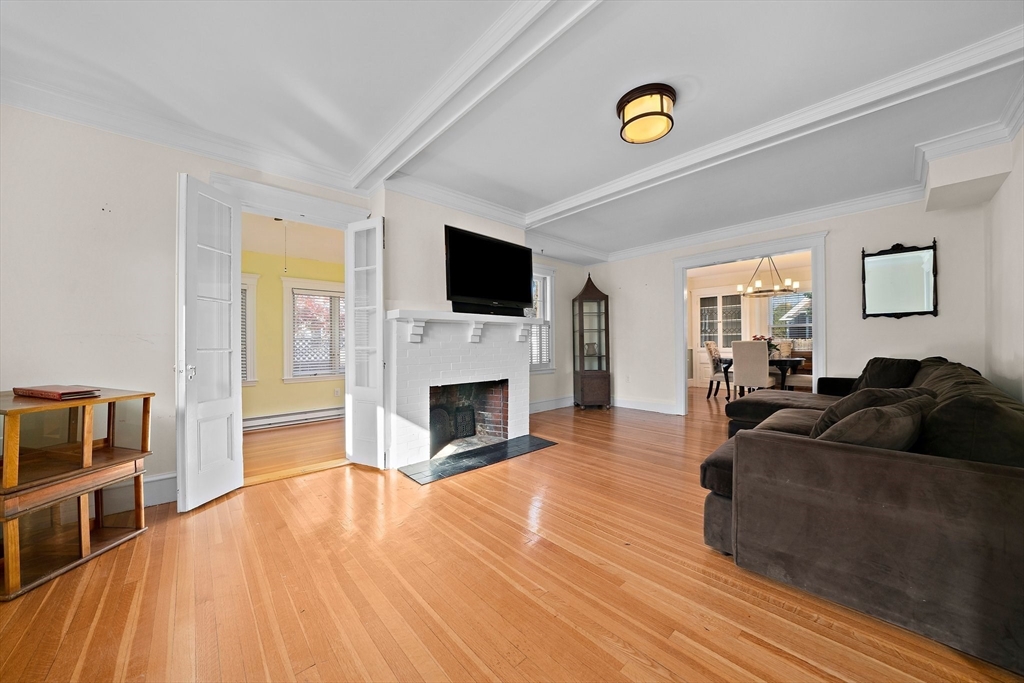 11 Gordon Road Needham, MA 02492 - Photo 7 of 42 a living room with furniture and a fireplace