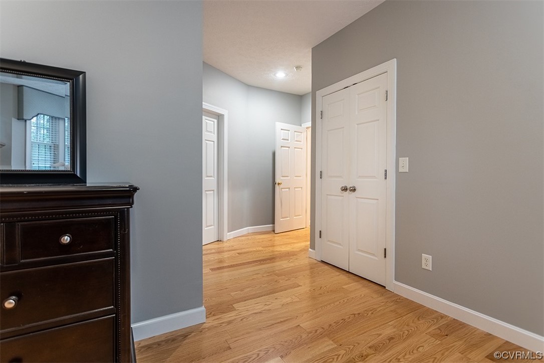 11570 Royal Lane Providence Forge, VA 23140 - Photo 17 of 49 a view of an empty room with wooden floor and cabinet