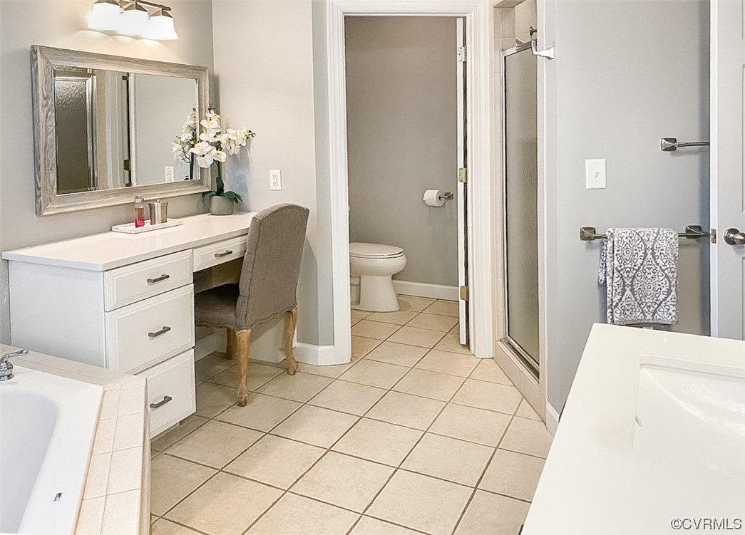 11570 Royal Lane Providence Forge, VA 23140 - Photo 19 of 49 a spacious bathroom with a sink mirror and toilet