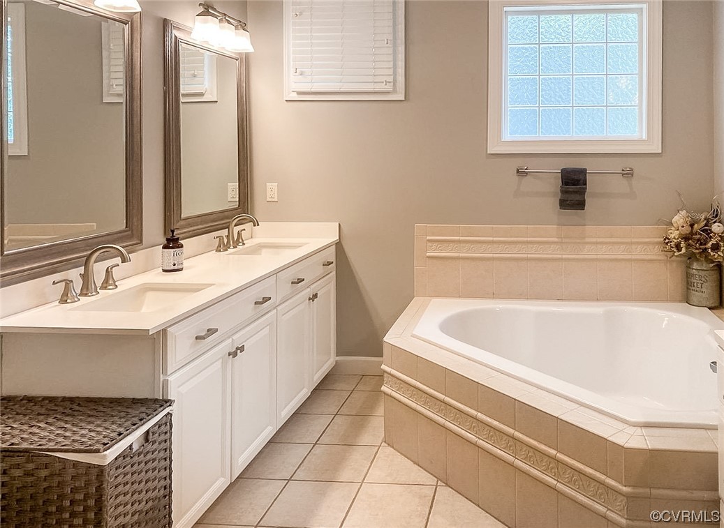 11570 Royal Lane Providence Forge, VA 23140 - Photo 20 of 49 a spacious bathroom with a bathtub sink and a window
