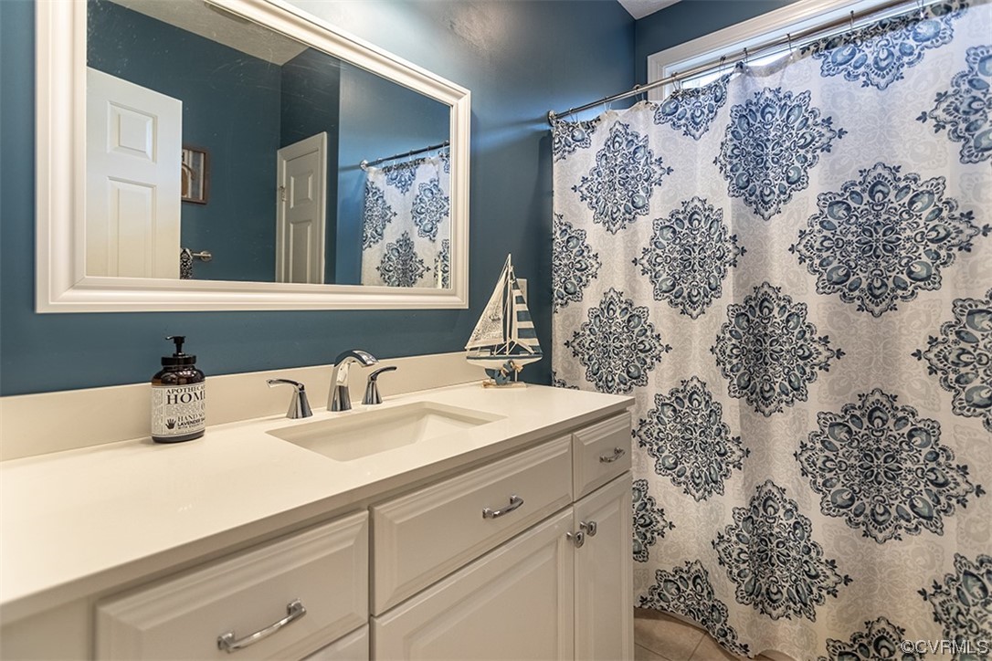 11570 Royal Lane Providence Forge, VA 23140 - Photo 23 of 49 a bathroom with a sink and a mirror
