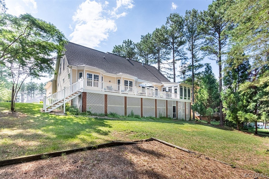 11570 Royal Lane Providence Forge, VA 23140 - Photo 40 of 49 a view of a white house with a big yard and large trees