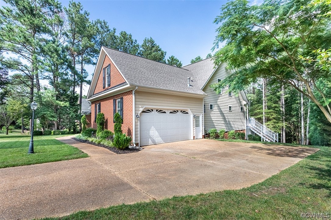 11570 Royal Lane Providence Forge, VA 23140 - Photo 49 of 49 a front view of a house with a yard and trees