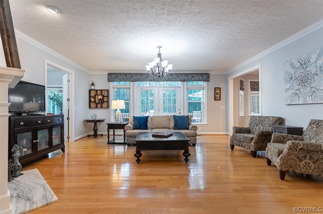 11570 Royal Lane Providence Forge, VA 23140 - Photo 6 of 49 a living room with furniture and a chandelier