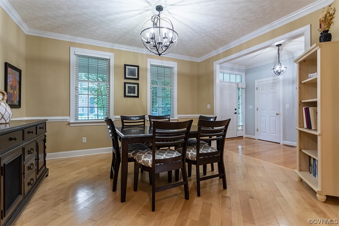 11570 Royal Lane Providence Forge, VA 23140 - Photo 9 of 49 a view of a dining room with furniture window and wooden floor