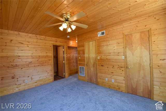 1129 Ponderosa Road, Unit 40 Hatch, UT 84735 - Photo 20 of 47 Wood paneling throughout, wood plank ceiling, light-toned wood doors, and a ceiling fan with integrated lighting