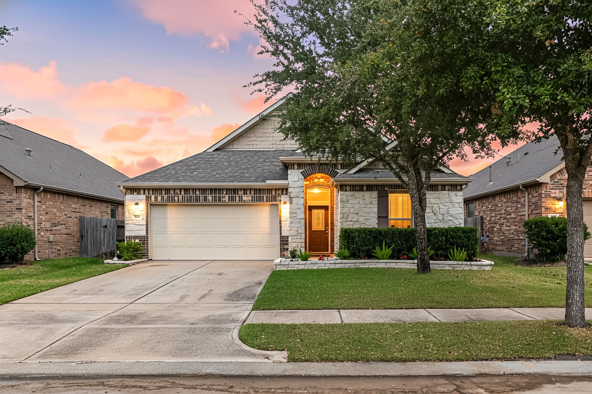 24014 Adobe Ridge Lane Katy, TX 77493 - Photo 1 of 45 a front view of a house with a yard and garage
