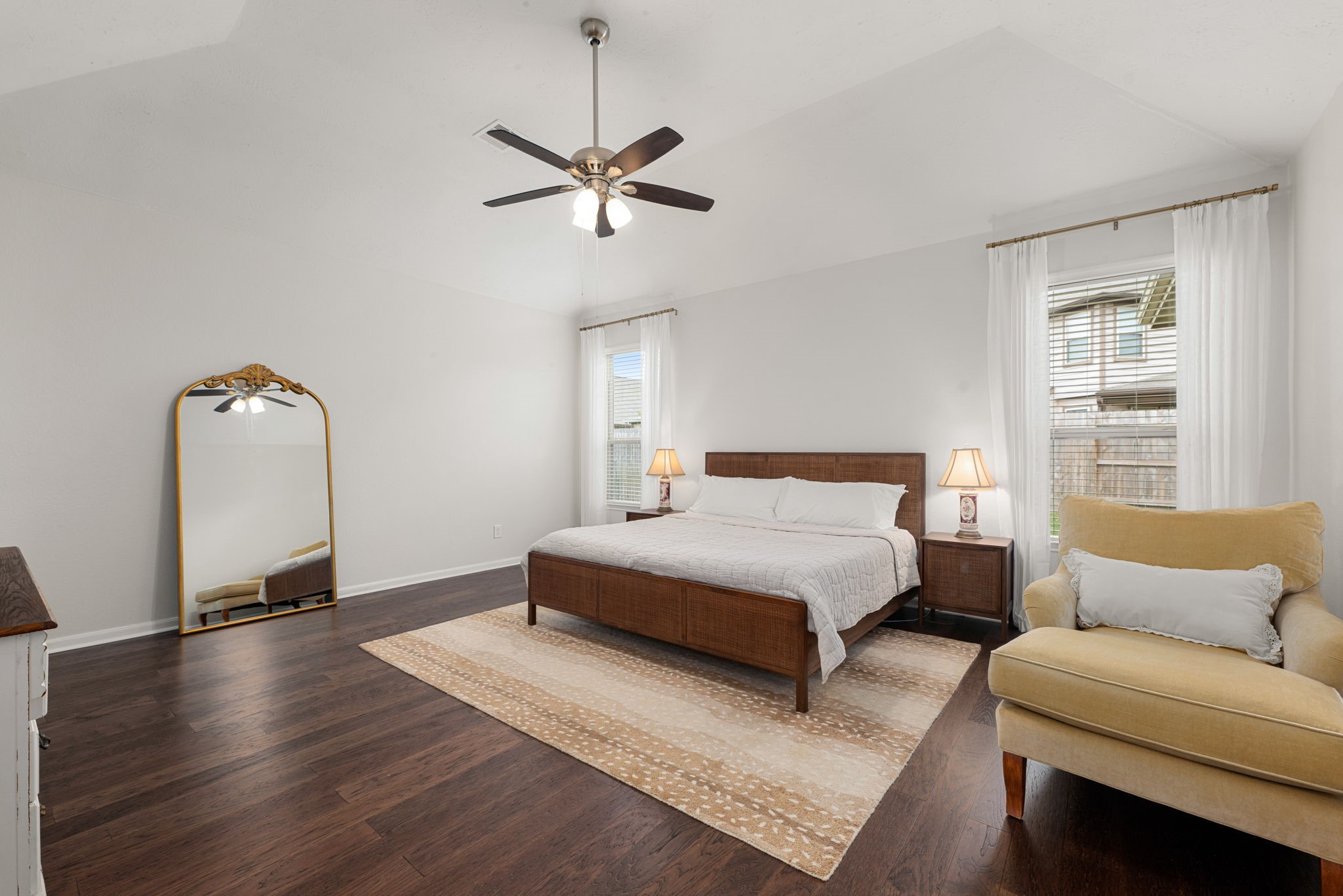 24014 Adobe Ridge Lane Katy, TX 77493 - Photo 19 of 45 a spacious bedroom with a bed couch and window