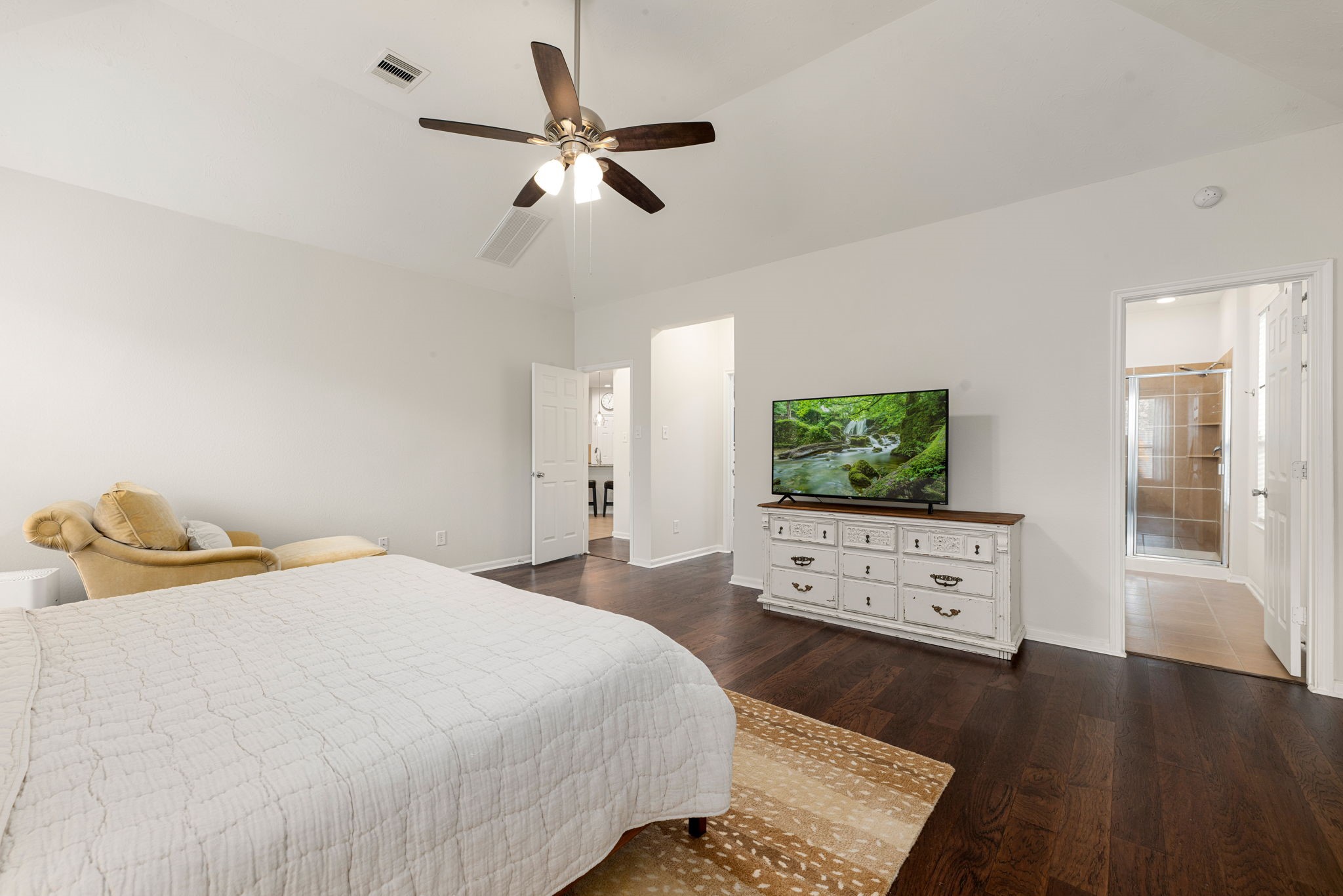 24014 Adobe Ridge Lane Katy, TX 77493 - Photo 21 of 45 a bedroom with a bed and wooden floor