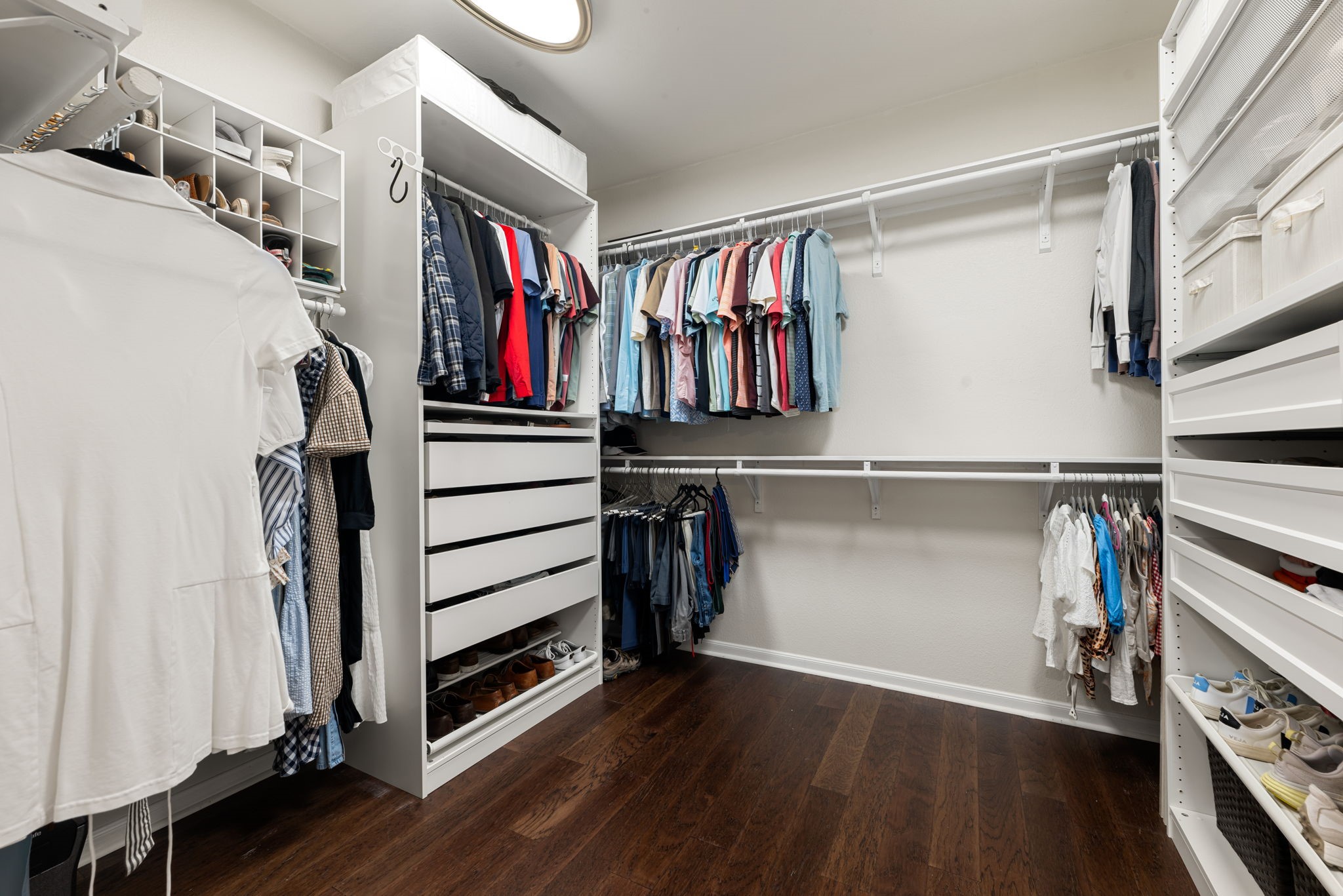 24014 Adobe Ridge Lane Katy, TX 77493 - Photo 22 of 45 a view of walk in closet with clothes and shoes
