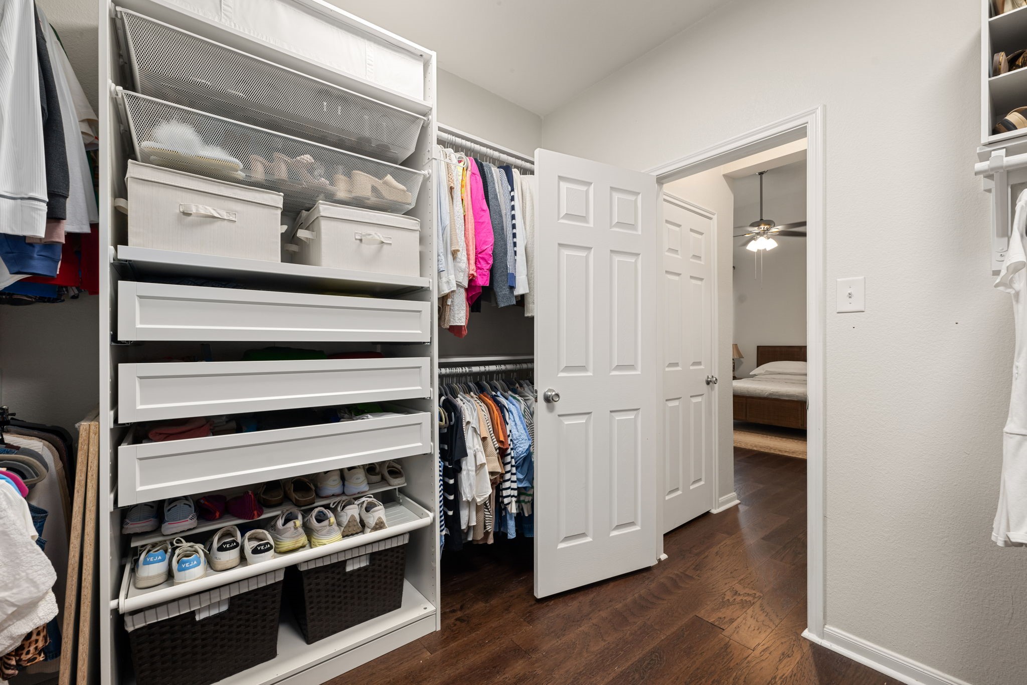 24014 Adobe Ridge Lane Katy, TX 77493 - Photo 23 of 45 a view of walk in closet with clothes and shoes