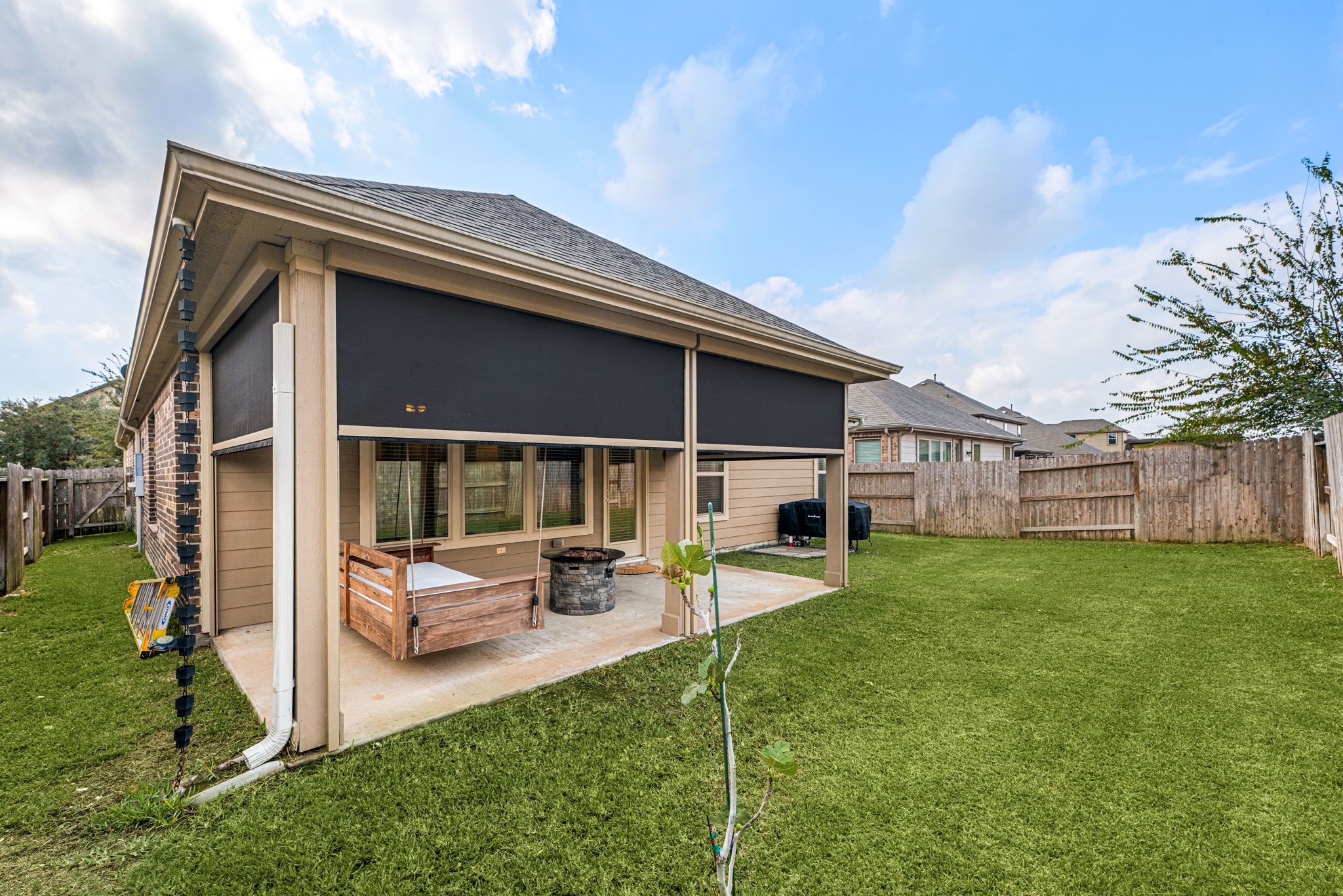 24014 Adobe Ridge Lane Katy, TX 77493 - Photo 30 of 45 a view of an house with backyard porch and furniture
