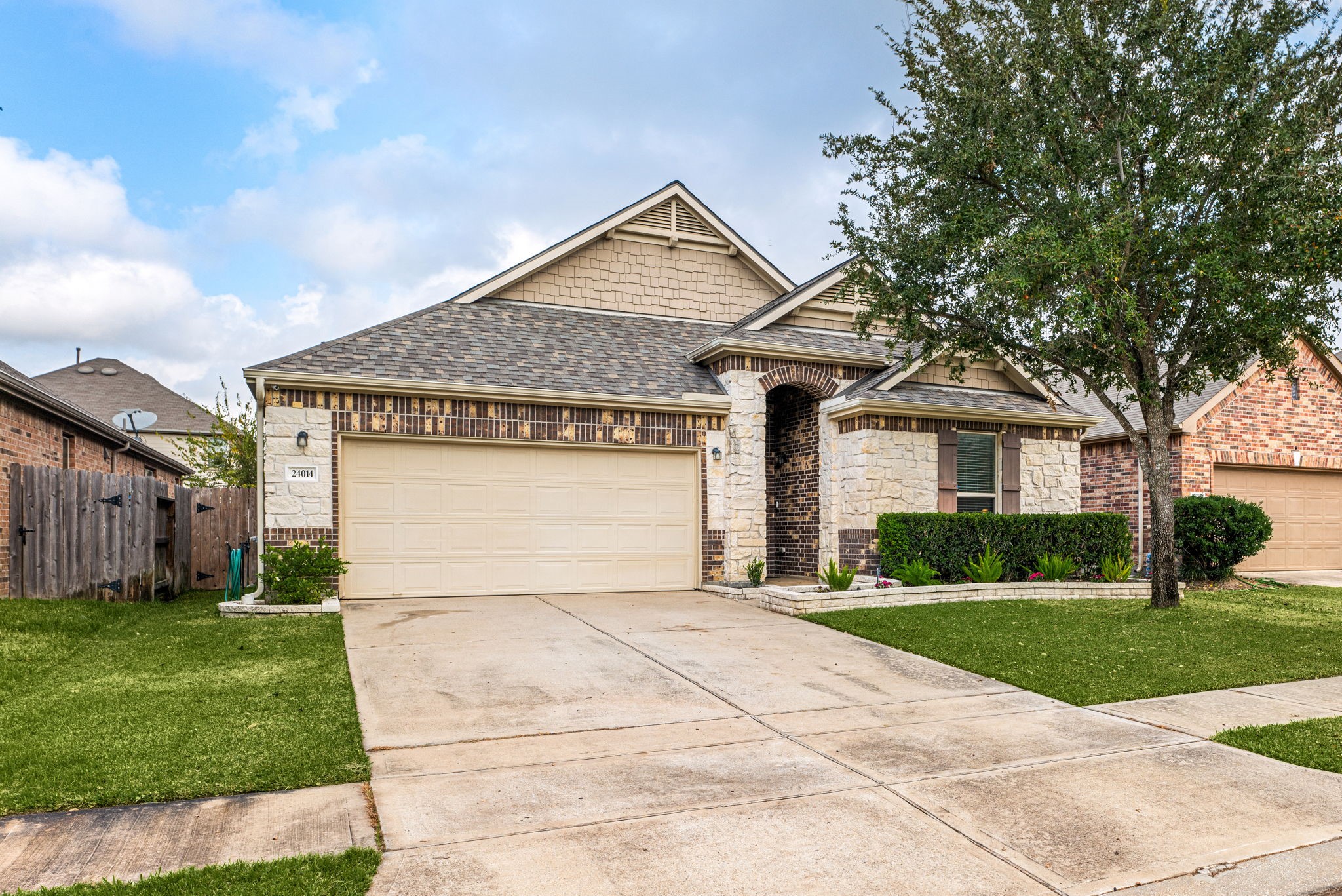 24014 Adobe Ridge Lane Katy, TX 77493 - Photo 3 of 45 a front view of a house with a yard and garage
