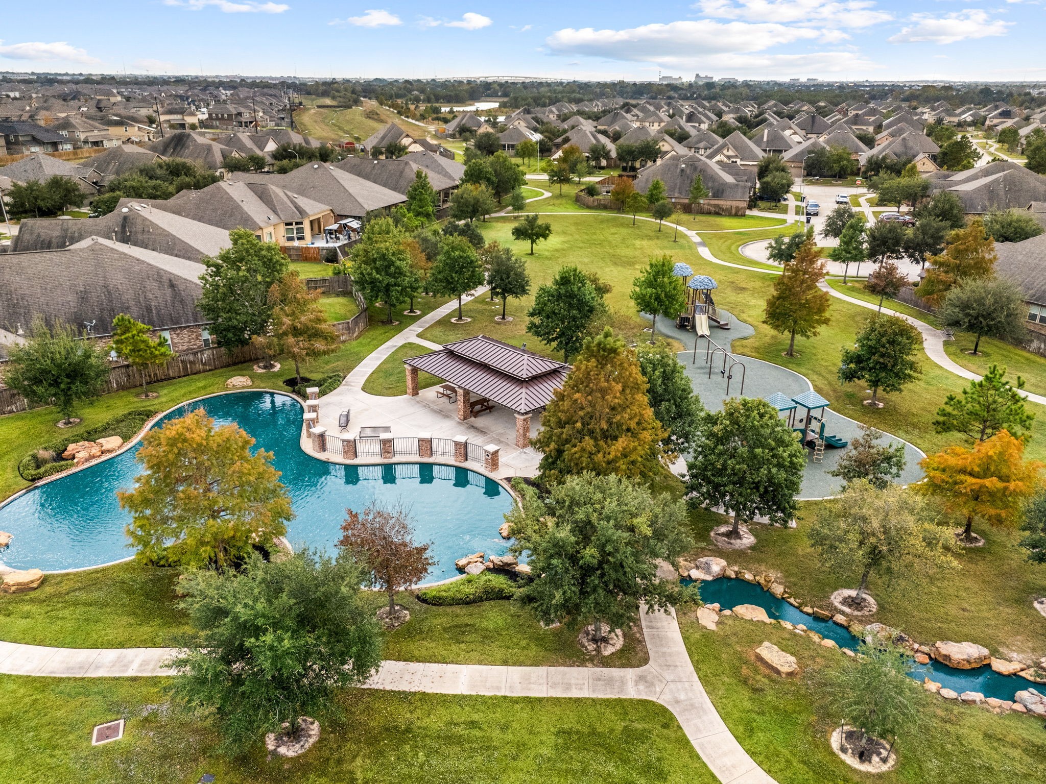24014 Adobe Ridge Lane Katy, TX 77493 - Photo 32 of 45 an aerial view of residential houses with outdoor space and swimming pool