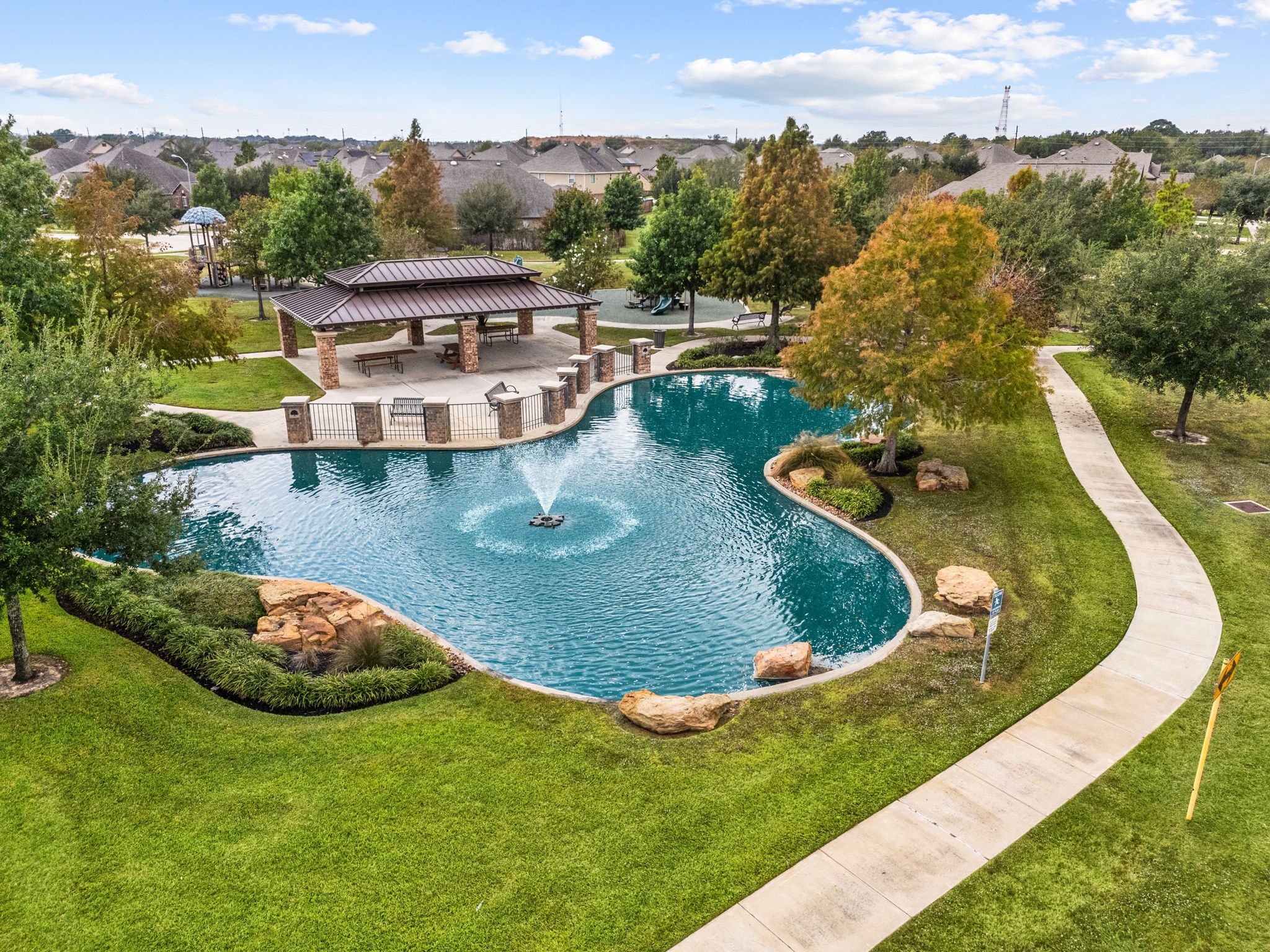 24014 Adobe Ridge Lane Katy, TX 77493 - Photo 33 of 45 a view of a swimming pool with a yard