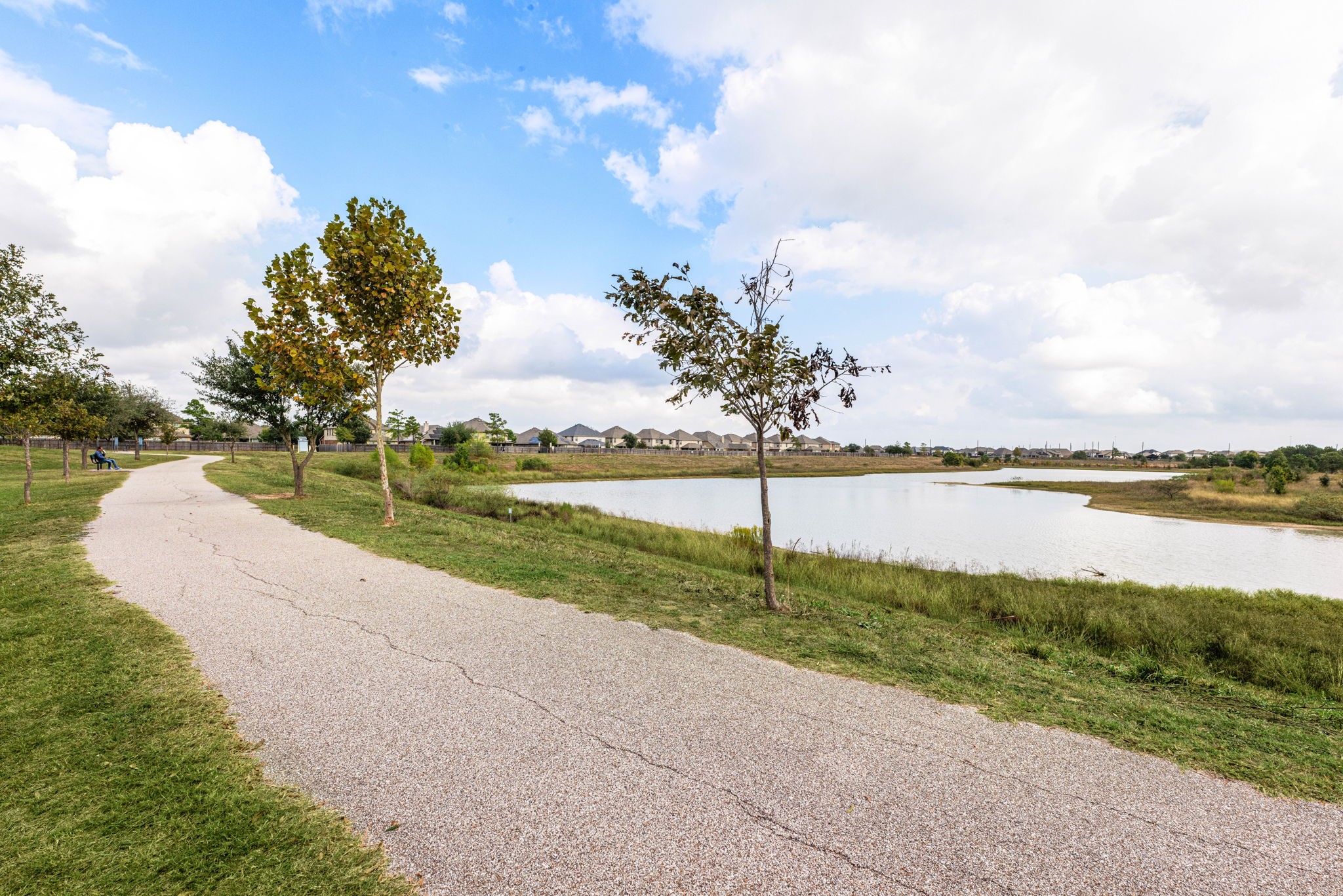 24014 Adobe Ridge Lane Katy, TX 77493 - Photo 42 of 45 a view of a lake with a big yard