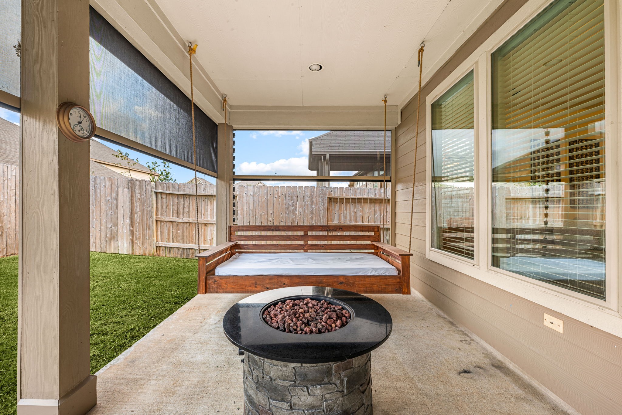 24014 Adobe Ridge Lane Katy, TX 77493 - Photo 5 of 45 a view of a porch with furniture and floor to ceiling window