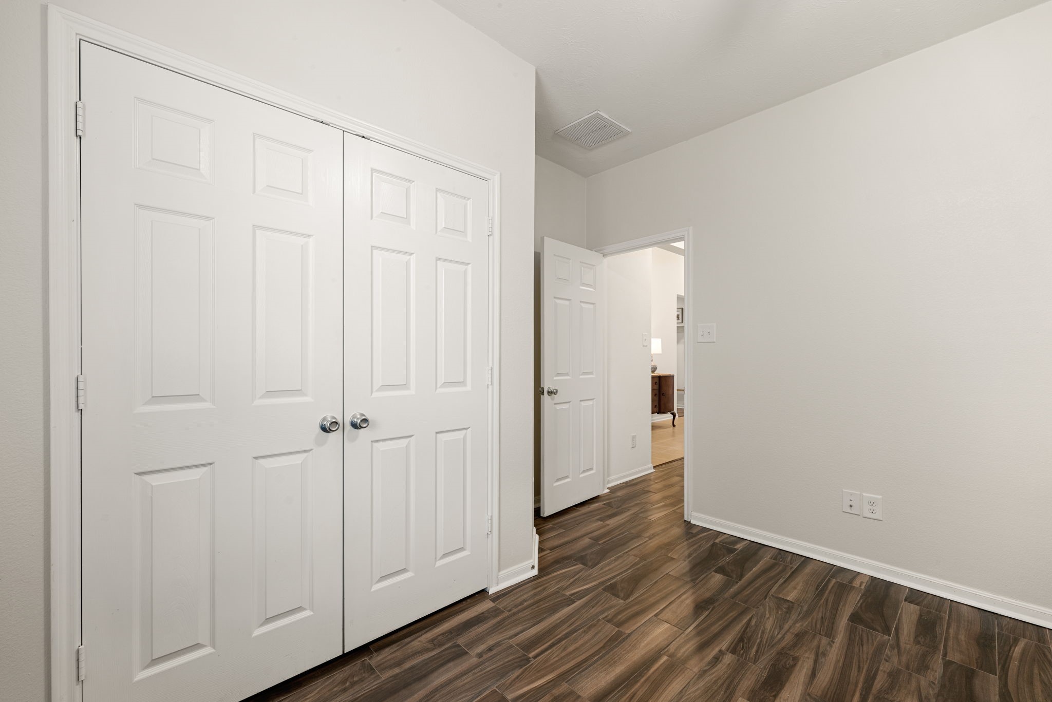 24014 Adobe Ridge Lane Katy, TX 77493 - Photo 7 of 45 a view of an empty room with wooden floor