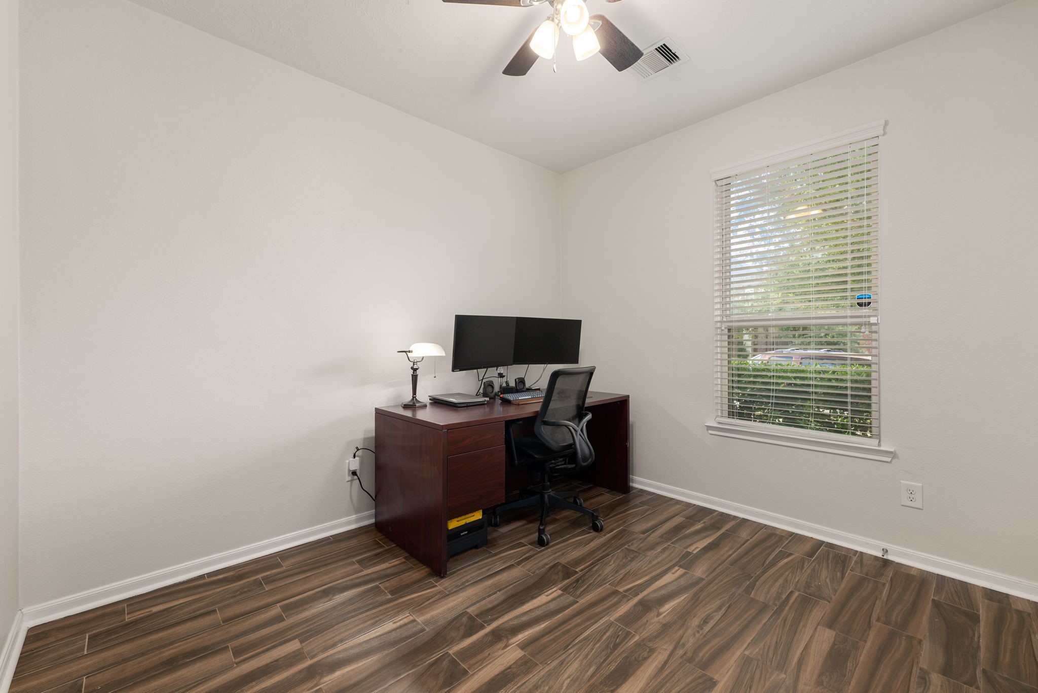 24014 Adobe Ridge Lane Katy, TX 77493 - Photo 8 of 45 a view of workspace with wooden floor and windows