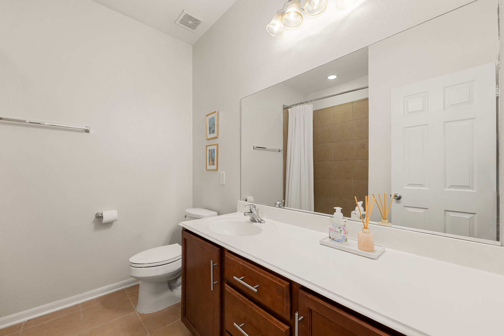 24014 Adobe Ridge Lane Katy, TX 77493 - Photo 10 of 45 a bathroom with a sink a toilet and a mirror