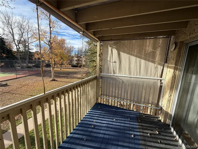 a view of balcony with wooden floor