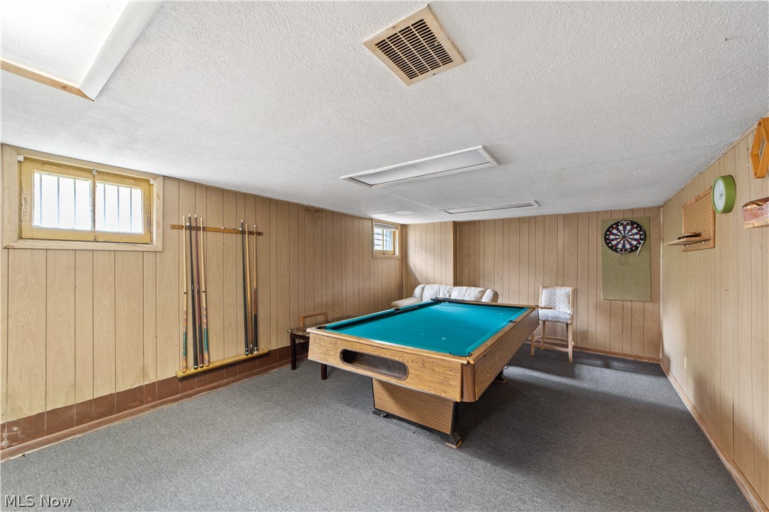 3076 Yorkshire Road Cleveland, OH 44118 - Photo 32 of 47 Game room with a textured ceiling, wooden walls, and billiards