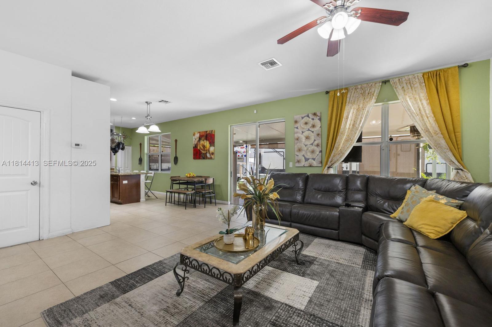 11501 Southwest 228th Lane Miami, FL 33170 - Photo 11 of 44 a living room with furniture and a large window